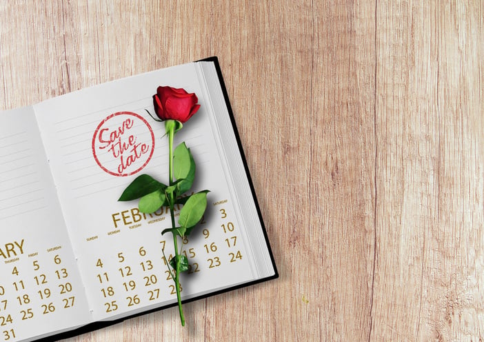 Photomontage Of Stamp On A Calendar With Red Rose